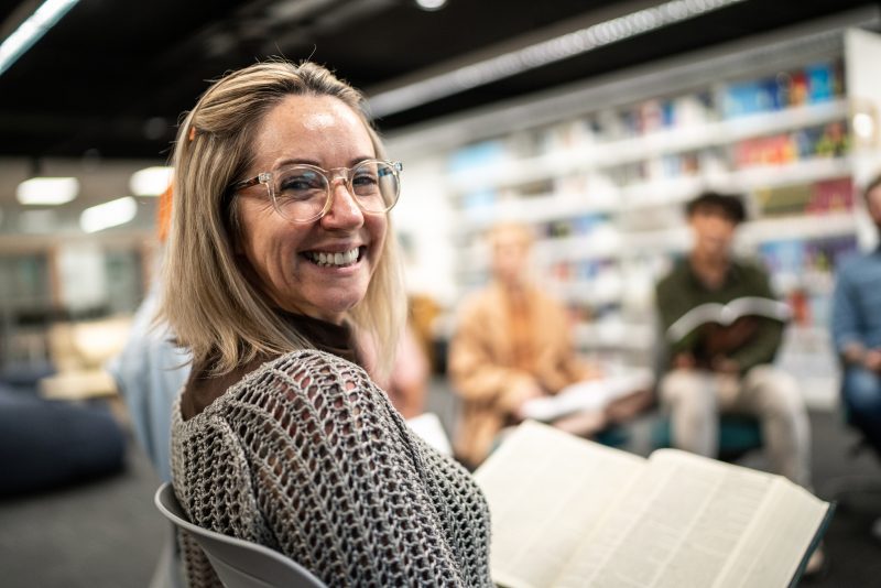 Portrait of mature woman in a circle group at university
